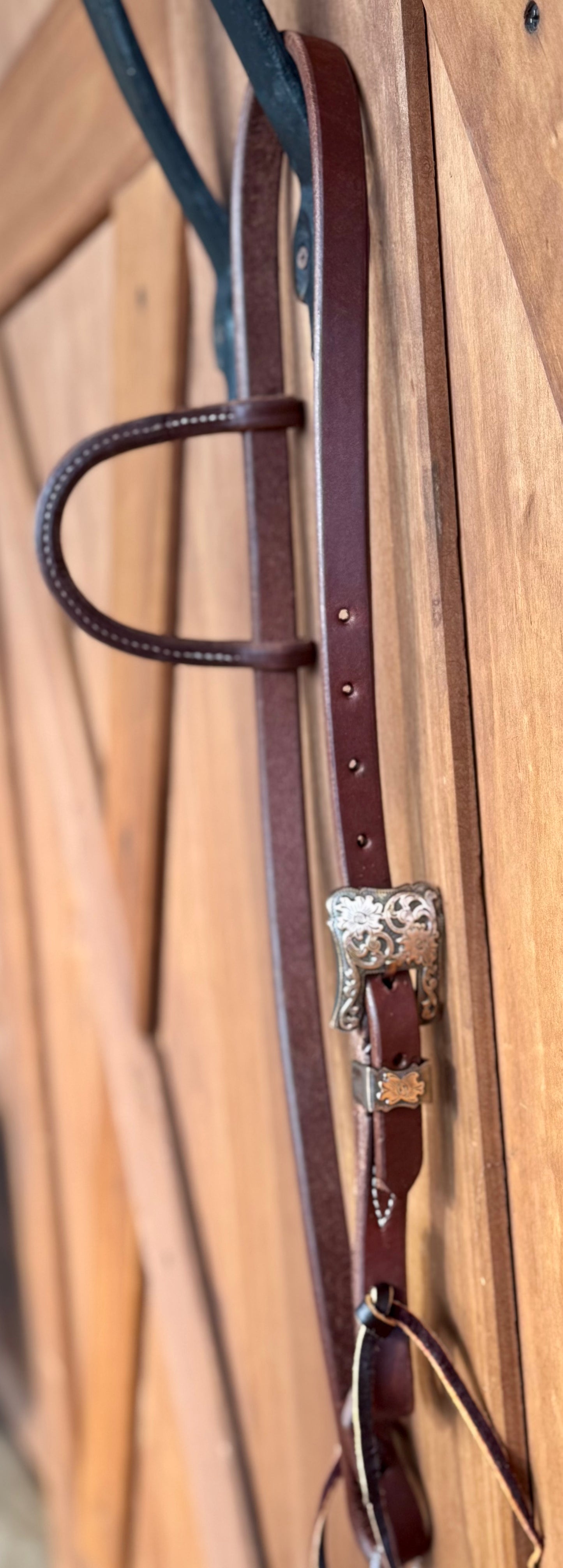 3/4” slip ear bridle with single antique copper buckle with floral scroll