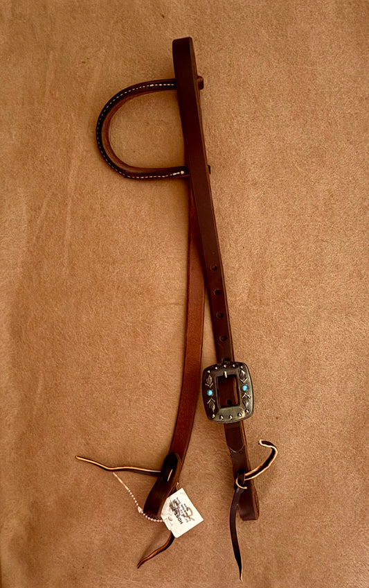 3/4” slip ear bridle. Single feather and turquoise stone buckle