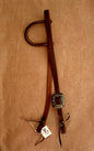 3/4” slip ear bridle. Single feather and turquoise stone buckle