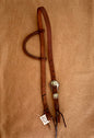 Slip ear bridle with green thunderbird buckle